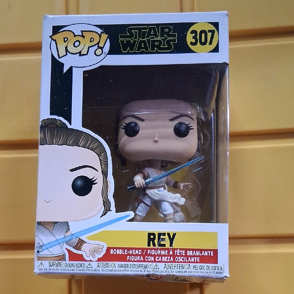 Pop Star Wars Rey Vinyl Figure with Blue Lightsaber